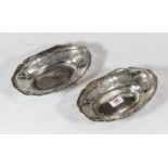 A pair of George VI silver sweetmeat dishes, each of pierced oval form, maker Richard Comyns, London