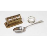 An Art Deco brass cased perpetual desk calendar; together with a George III silver serving spoon;