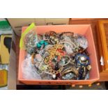 A large collection of modern costume jewellery to include various bangles, beaded necklaces, etc