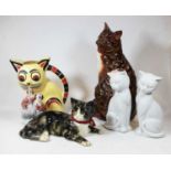 A collection of assorted cat ornaments, to include Staffordshire and Winstanley examples; together