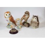 A Beswick model of an owl, impressed Beswick England, model No.1046, h.19cm; together with another