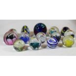 A collection of modern glass paperweights