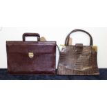 A lady's crocodile skin and brass mounted handbag; together with a leather satchel (2)