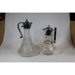 In the manner of Christopher Dresser, a claret jug, having star cut base with silver plated mounts