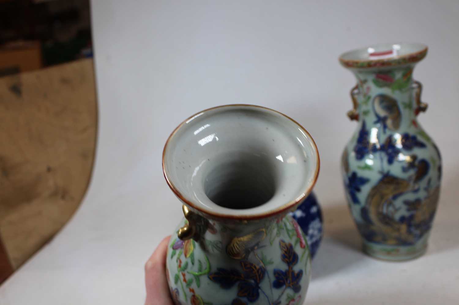 A pair of stoneware vases, each of baluster form, enamel decorated with various birds, butterflies - Image 3 of 13