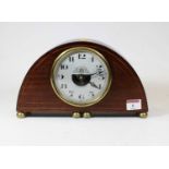 An early 20th century French mahogany and boxwood strung cased Electrique mantel clock, the convex