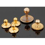 A set of three 9ct gold collar studs, 1.6g; together with a single 15ct gold collar stud, 2.2g;