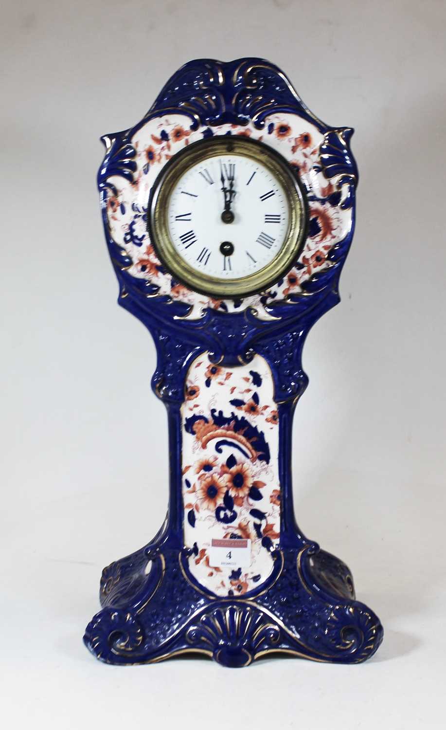 An early 20th century S Fielding & Co porcelain cased mantel clock, decorated in shades of cobalt