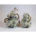 An early 20th century Continental porcelain floral encrusted jug, the handle in the form of a