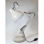 A cream painted anglepoise desk lamp