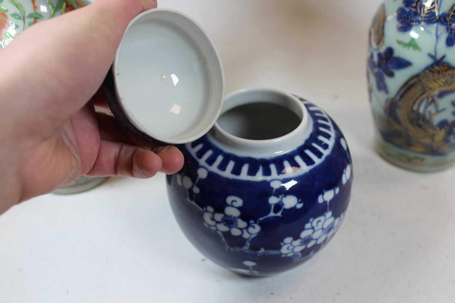 A pair of stoneware vases, each of baluster form, enamel decorated with various birds, butterflies - Image 7 of 13