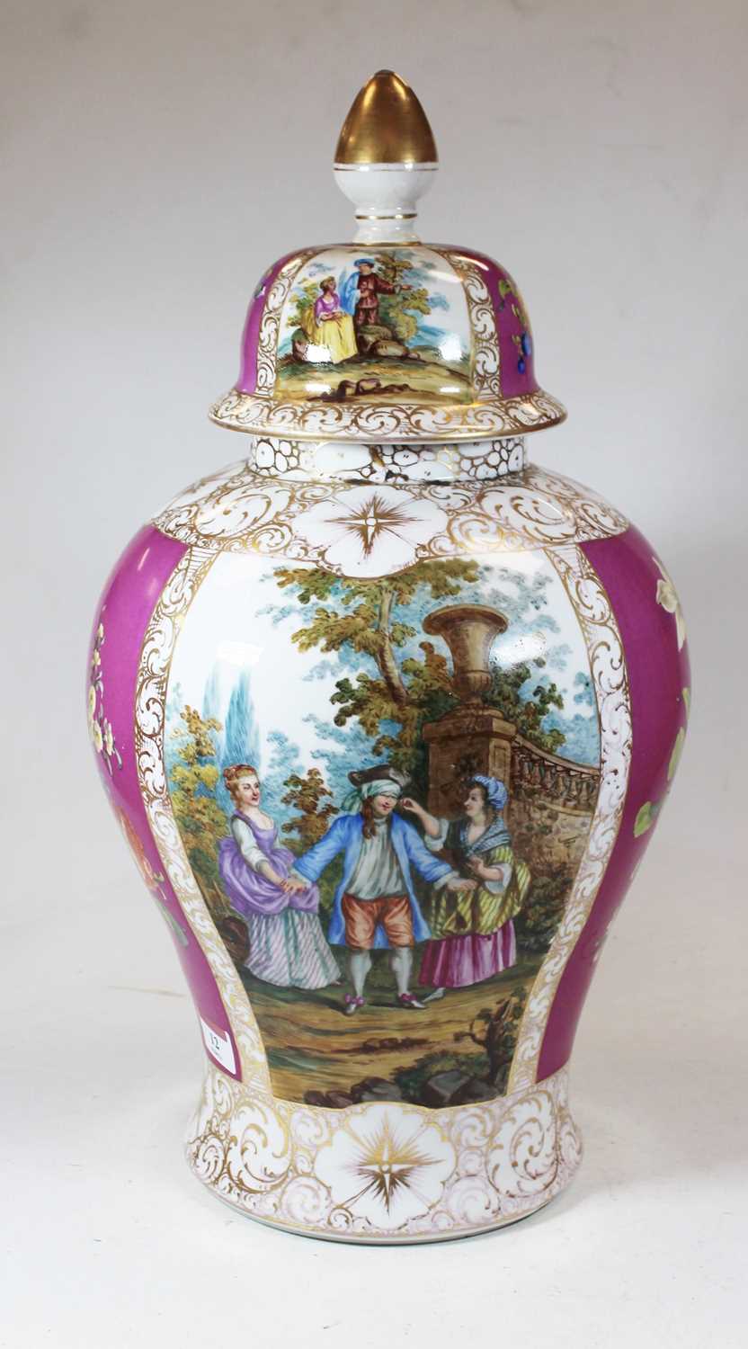 A large early 20th century German porcelain vase and cover, of baluster form, decorated with figures