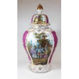 A large early 20th century German porcelain vase and cover, of baluster form, decorated with figures