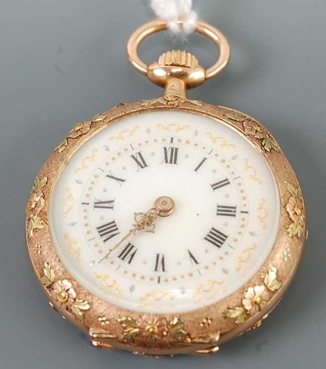 A continental lady's two-colour gold cased open faced pocket watch, the engraved and floral chased