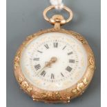 A continental lady's two-colour gold cased open faced pocket watch, the engraved and floral chased