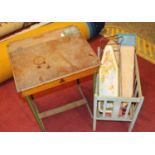 A 1950s lift top children's desk together with various Chad Valley and Triang ironing boards and a