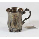 A Victorian silver christening tankard having foliate engraved decoration and C-scroll handle on