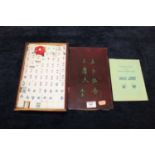 A Chinese mah-jong set in wooden case, with rule bookCondition report: Tiles are plastic/resin.