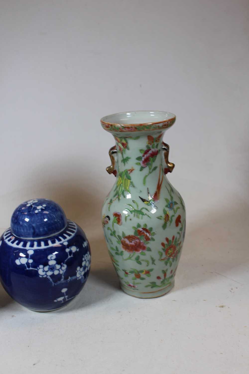 A pair of stoneware vases, each of baluster form, enamel decorated with various birds, butterflies - Image 10 of 13