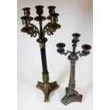 A reproduction brass 5-sconce table candelabra on a fluted column to a brass triform base, height