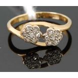 An 18ct gold and small rose cut diamond set flower head crossover ring, 1.7g, size I