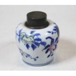 A Chinese export tea caddy of squat baluster form having a pewter cover with further inner cover