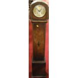A 1920s oak granddaughter clock, having twin winding holes (lacking pendulum), height 128cm