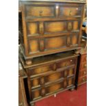 A pair of early 20th century joined oak chests of two short over two long drawers, raised on bun