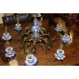 A Dutch brass and blue & white underglaze ceramic mounted eight light hanging electrolier, approx