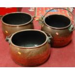 Three various late 19th century copper and wrought iron swing handled cauldrons