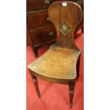 A Regency mahogany panelled seat single hall chair, the lozenge detail back with polychrome