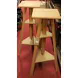 A pair of contemporary Mabef Italian plywood and beech rotating sculpture stands, with adjustable