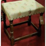 A contemporary joined oak and tapestry studded upholstered dressing stool, width 46.5cm