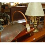 An early 20th century copper swing handled log bucket, together with a brass table lamp (2)