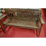 A stained and slatted teak three seater garden bench, width 162cm