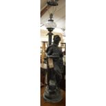 A large early 20th century spelter table lamp, modelled as a standing Greek goddess dressed in