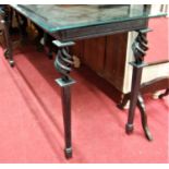 A heavy plate glass topped and painted wrought iron based long conservatory console table, width