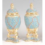 A pair of Grainger & Co Royal Chinaworks Worcester reticulated vases and covers, each decorated in