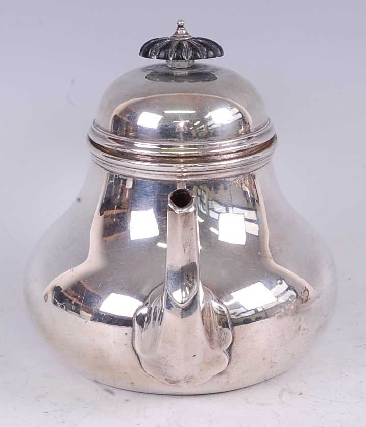 A late Victorian silver teapot, in the early 18th century style, having a hinged domed cover and - Image 2 of 5