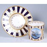 A Lynton Porcelain Company cabinet cup and saucer, polychrome enamel decorated with a reserve of