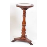 A late Regency mahogany jardinière stand, having white marble inset top on turned and knopped column
