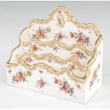 A 19th century porcelain letter-rack, having three tiered sections, polychrome enamel decorated with