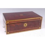 An early 19th century mahogany and brass bound campaign writing slope, having flush brass carry