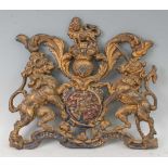 A Victorian cast iron architectural Royal Coat of Arms, cast in relief with the crowned English lion