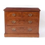 A figured walnut chest in the early 18th century style, having a four-quarter veneered and