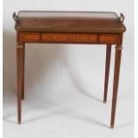 A 19th century mahogany and kingwood tray-top side table, in the French Empire style, the top