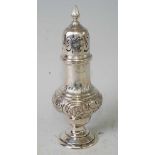 A late Victorian silver pedestal lighthouse sugar caster, having a finial topped pierced dome cover,
