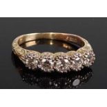 A yellow metal diamond five-stone half hoop eternity ring, comprising five graduated round brilliant