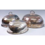 A set of five circa 1900 silver plated graduated meat dish covers, each having detachable handles