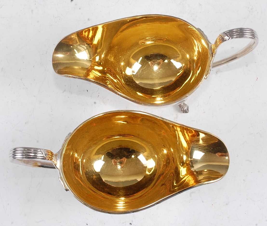 A pair of Mappin & Webb silver sauceboats, each having gilt-washed interiors, reeded edges, and on - Image 5 of 5